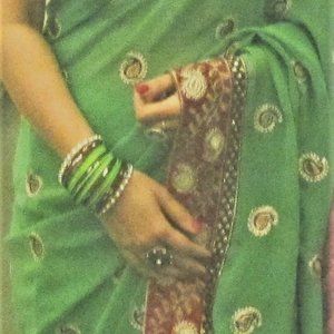 Green georgette saree with red and gold border